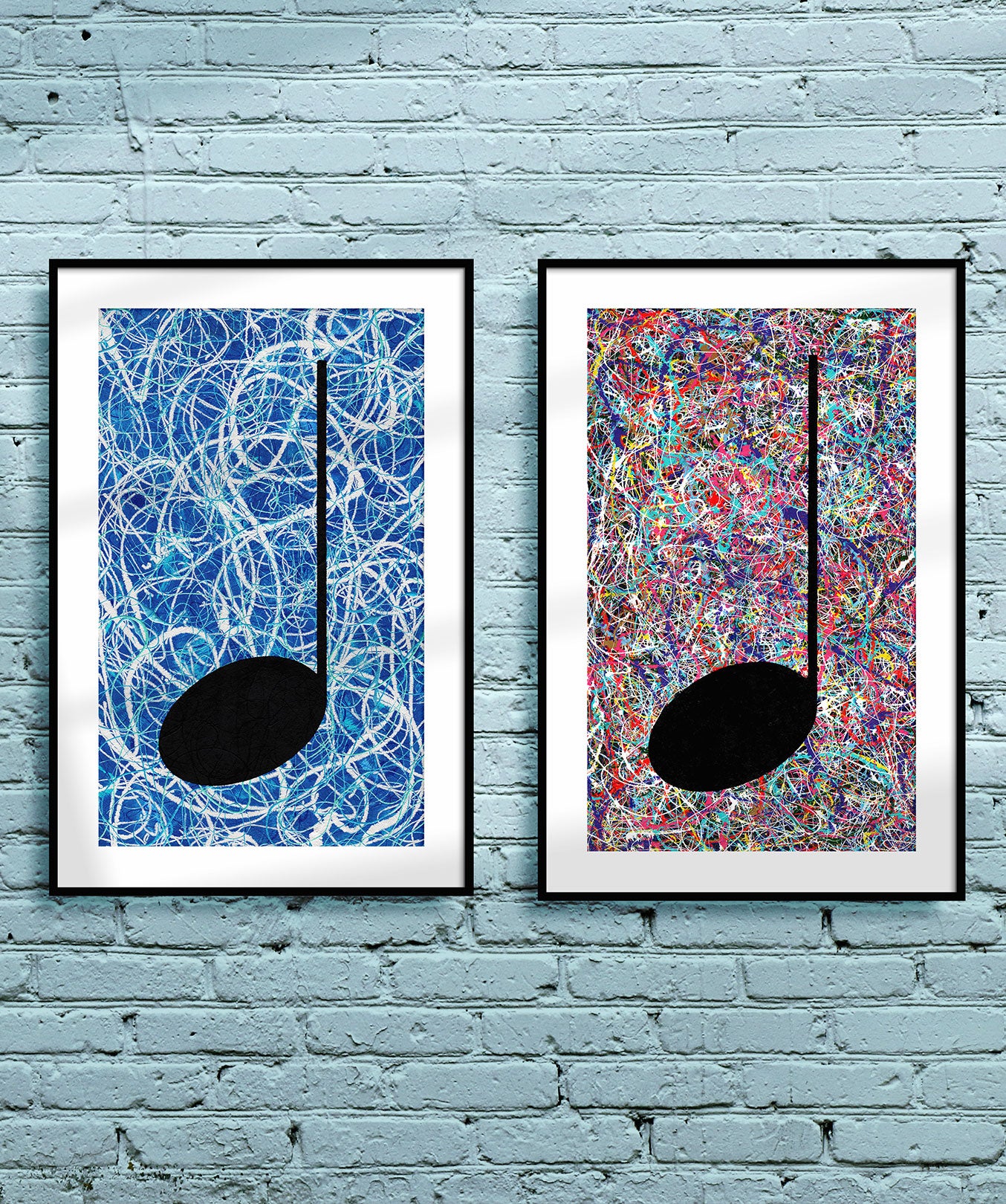 Pair of framed silver and blue Music themed Giclée Prints hanging on a light blue brick wall