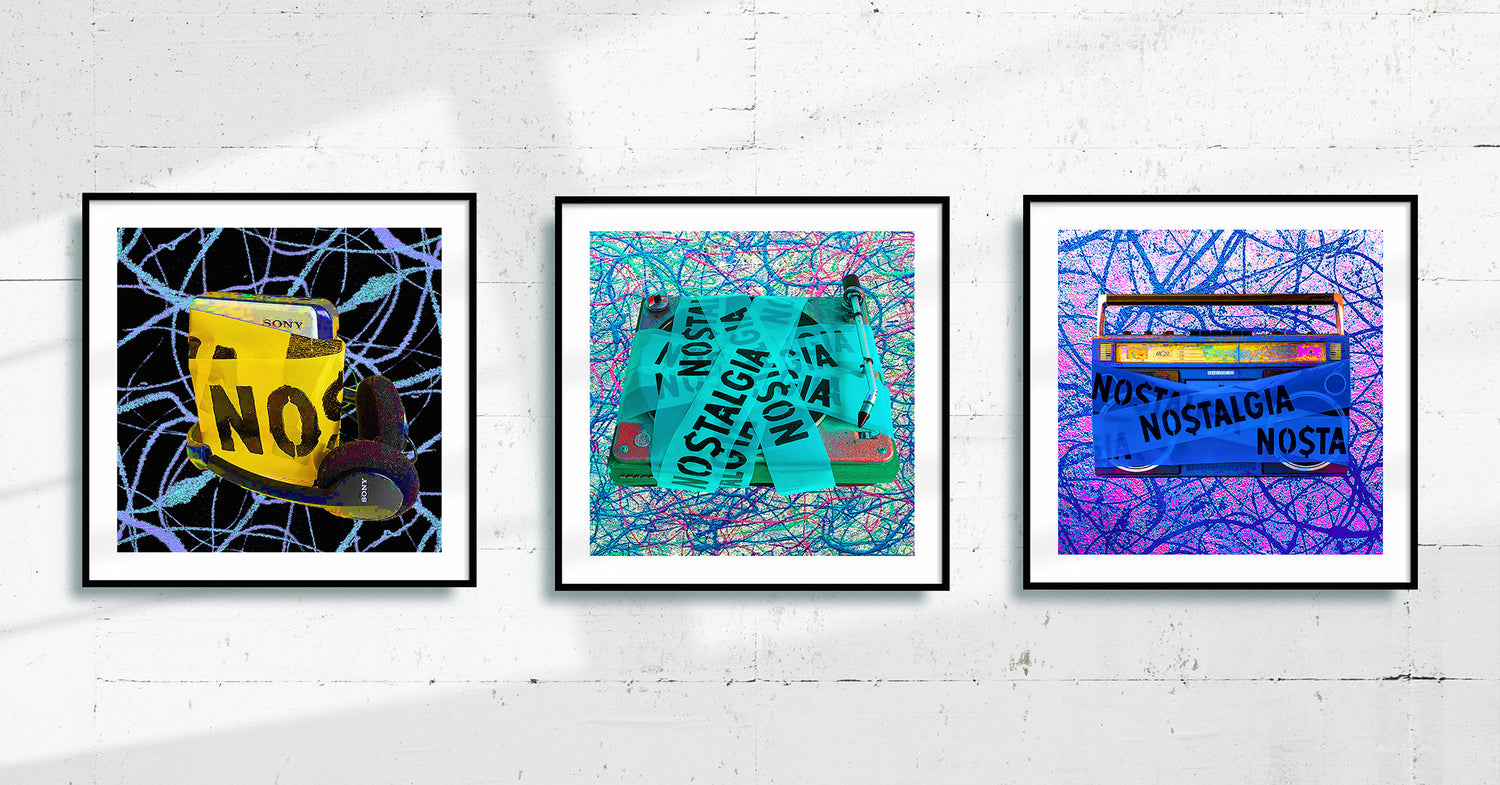 Three Art Prints, framed and hanging on a white concrete industrial art gallery wall 