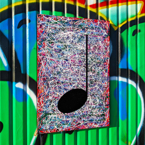 Red and multi coloured music art painting with street art background