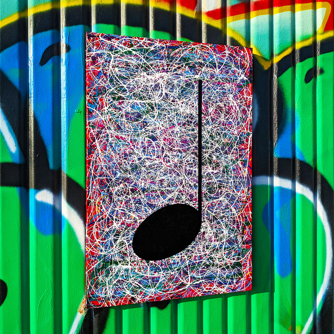 Red and multi coloured music art painting with street art background