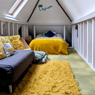 Studio bedroom crash pad room with yellow fabric fixtures