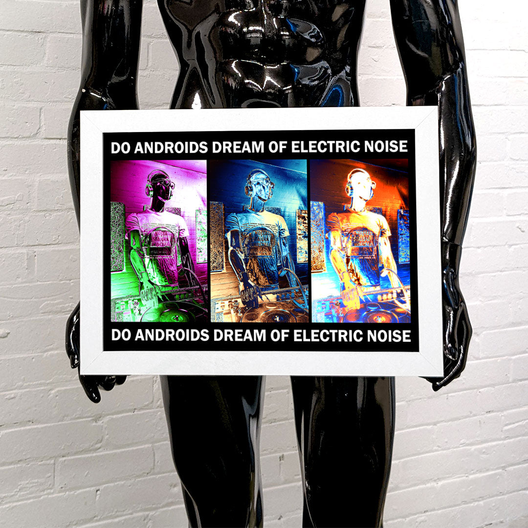 Black mannequin holding a framed art print of a DJ