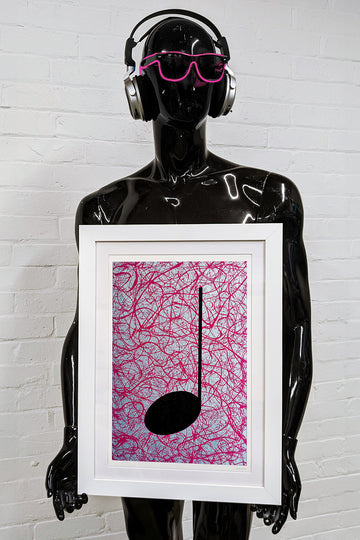 Framed Print of a MUSIC GRAFFITI painting held by a black gloss mannequin