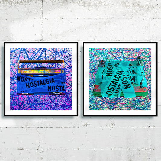 Two music art prints framed in black on a white gallery wall