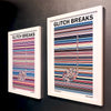A pair of multicoloured Music Art prints in white frames on a grey painted gallery wall