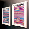 A pair of multicoloured Music Art prints in white frames on a metallic grey painted gallery wall
