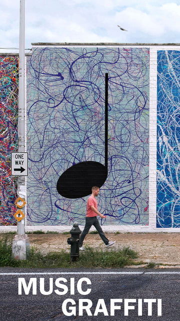 A high brick wall Street Art Mural of an Abstract Music Painting with a man walking past
