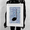 Framed silver and purple music art giclée print held by a black mannequin