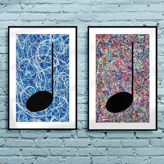 Pair of framed silver and blue Music themed Giclée Prints hanging on a light blue brick wall