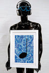 Blue framed music art giclée print held by a black mannequin with blue sunglasses and headphones