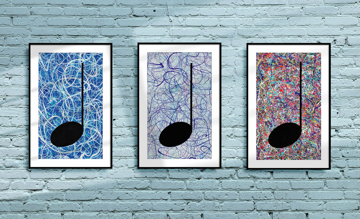 Three Music themed Art Prints, framed and hanging on a light blue industrial brick wall 