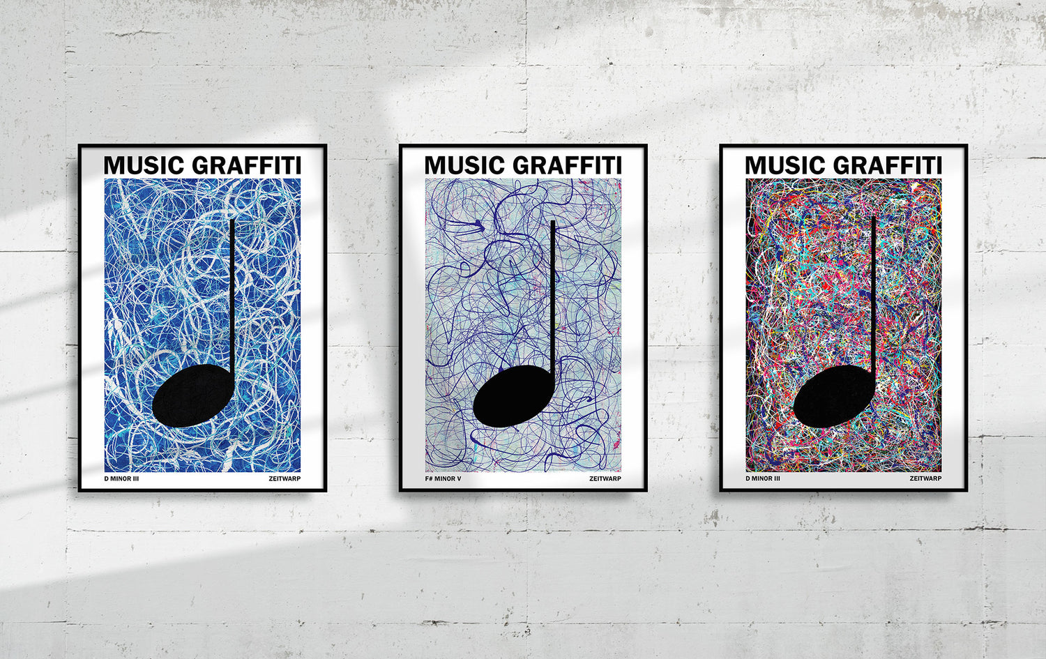 Three framed MUSIC GRAFFITI Art prints hanging on a light grey concrete wall
