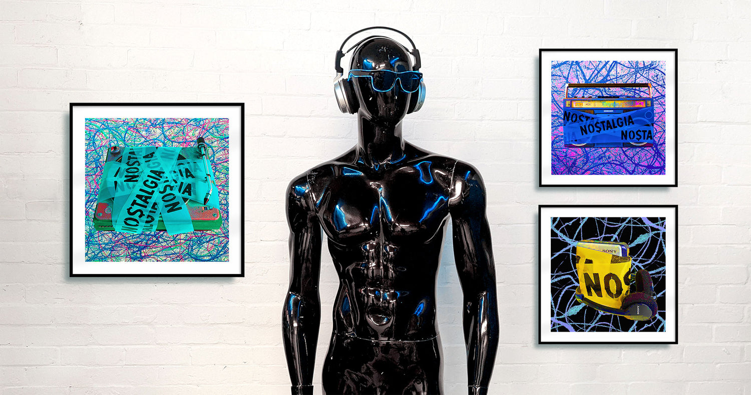 Black mannequin standing in an art gallery in front of three framed art prints