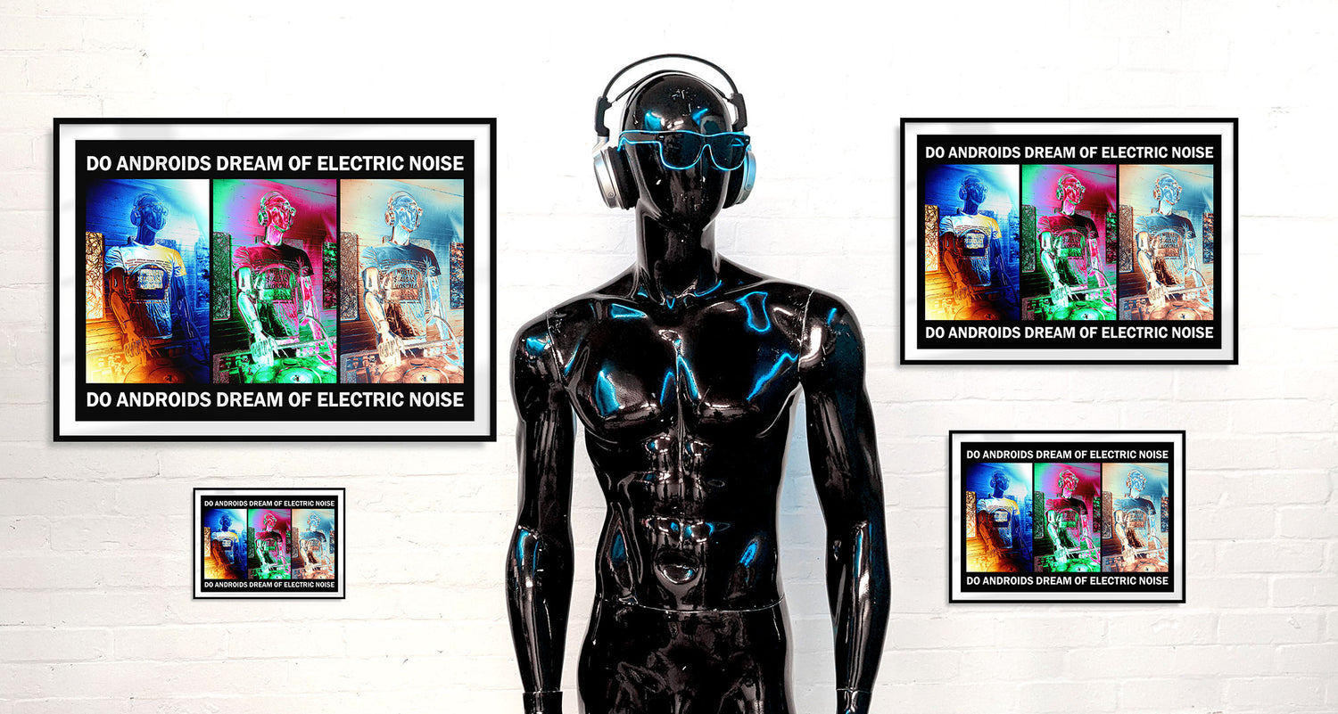 A futuristic black mannequin with sunglasses and headphones standing in front of four identical framed photos on a white wall