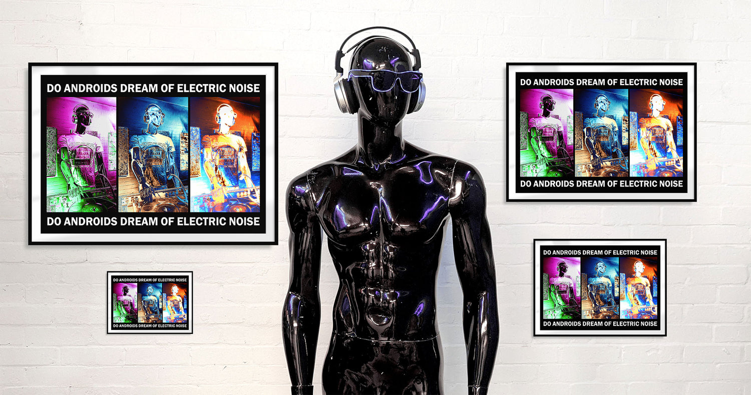 A futuristic black mannequin with sunglasses and headphones standing in front of four identical framed photos on a white wall