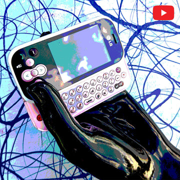 Black gloss hand holding a vintage LG mobile in front of an abstract background with the youtube logo in the top corner