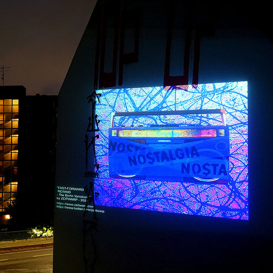 Artwork depicting a purple boombox projected onto the Berlin skyline in June 2021