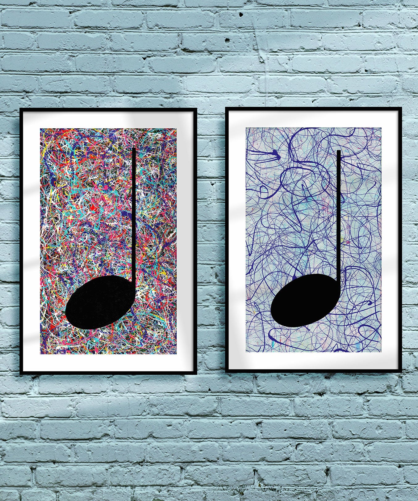 Pair of framed multicoloured Music themed Giclée Prints on a light blue brick wall